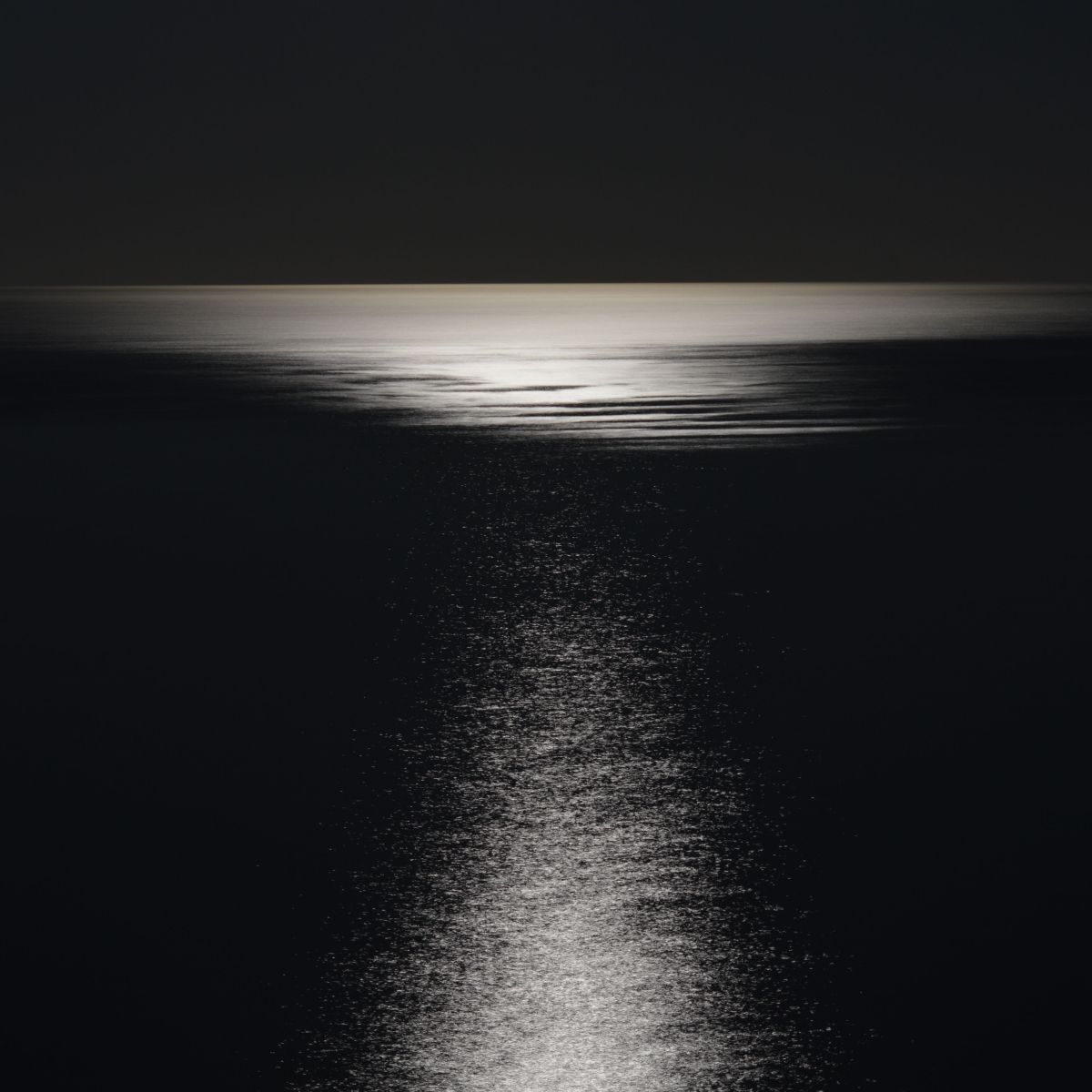 Moonlight over open water